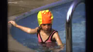 New York (1973): Young Girl Swimming In Pool Decides To Get Out Using Ladder