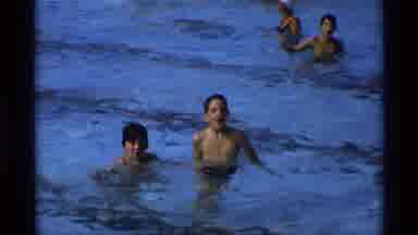 New York (1973): A Huge Number Of Persons Are Enjoying In The Swimming Pool Around