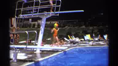 New York (1973): A Girl Very Carefully Jumbling Around The Swimming Pool