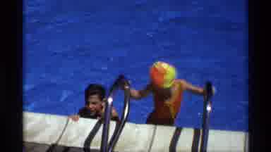 New York (1973): A Huge Number Of Persons Are Enjoying In The Swimming Pool Around