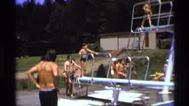 New York (1973): People Line Up For The Driving Board And Wait While The Boy Takes