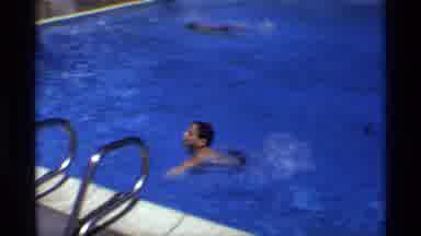 New York (1973): Boy Swimming Up To A Pool To Climb Out