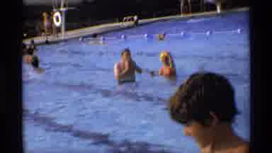New York (1973): People Are Happily Swimming Into A Deep Blue Swimming Pool