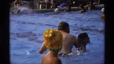 New York (1973): A Huge Number Of Persons Are Enjoying In The Swimming Pool Around