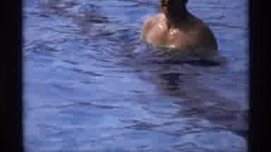 New York (1973): Kid On Pool Chair Watches Man In Pool
