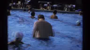 New York (1973): A Huge Number Of Persons Are Enjoying In The Swimming Pool Around