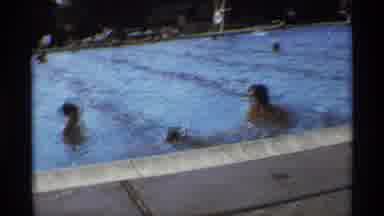 New York (1973): Man Splashes Two Kids In Pool On A Bright Sunny Day