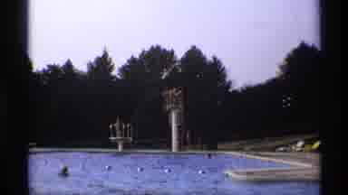New York (1973): Swimmers At A Swimming Pool Prepare To Dive Off Diving Boards By
