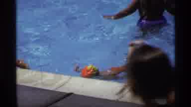 New York (1973): Little Kid Swims On Own At Community Pool With Friends