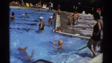 New York (1973): A Group Of People To Enjoy The Holiday In A Park Swimming