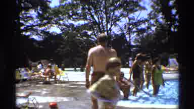 New York (1973): People Swim And Walk Around Pool In Swimsuits During Summer