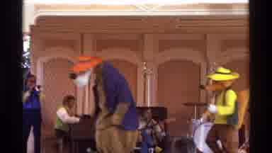 Orlando Florida (1974): People In Costume Dance On Stage As The Band Plays And The