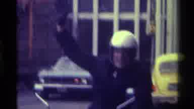 Kentucky (1976): Man Waging In A Motorcycle Helmet Then A Female Newscaster