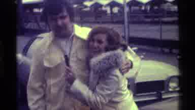 Kentucky (1976): Woman Wearing White Coat Interviews Man Wearing Yellow Jacket On