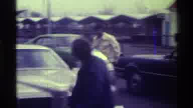 Kentucky (1976): Man Wearing White Shirt Gets Into White Car On A Clear Day