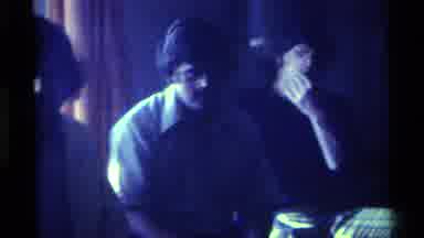 Kentucky (1976): Large Group Of Men And Women Interact Indoors At A Party Or