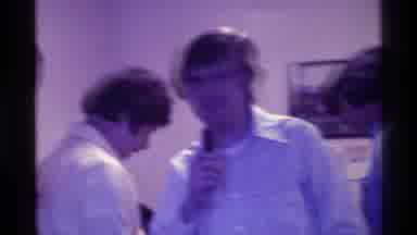 Kentucky (1976): One Man Surrounded By People Is Speaking Into A Microphone