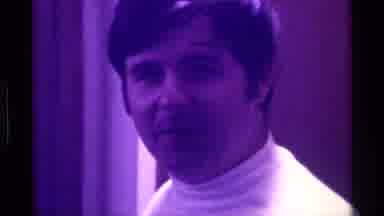 Kentucky (1976): Man Singing Or Talking In Front Of A Crowd Under Lights