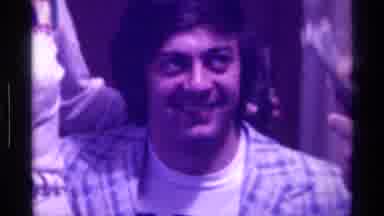 Kentucky (1976): A Man Laughing While Another Man Holds Money In His Hand