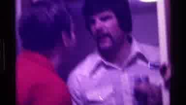 Kentucky (1976): Two Men Talk Indoors With Third Man Inserting Microphone Into
