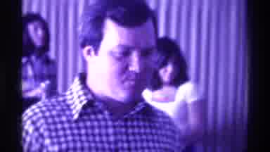 Kentucky (1976): White Male Speaks Into Microphone While Chewing And Cowboy Looks