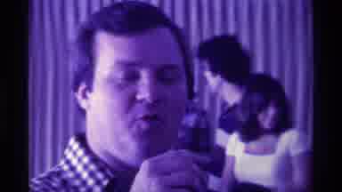 Kentucky (1976): Man Speaking Against Purple Background At Party Interacting With