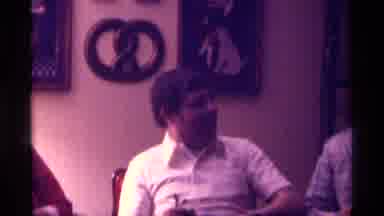Kentucky (1976): A Man In A Plaid Jacket Tips His Hat To The Camera As Another Man