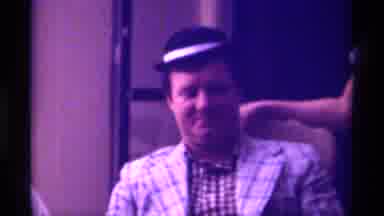 Kentucky (1976): Man Wearing Small Black Hat Looks At Man Wearing White Shirt