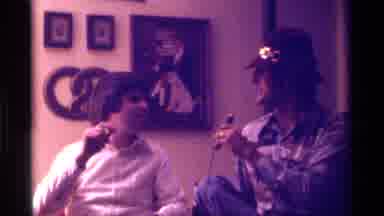 Kentucky (1976): Man Wearing Tan Hat Interviews Man Wearing White Shirt With Black