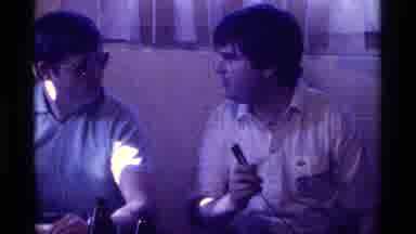 Kentucky (1976): Two Men Talk Indoors With Microphone And Open Bottles Of Alcohol