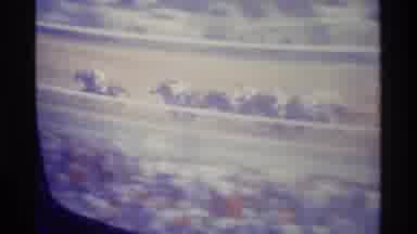 Kentucky (1976): Camera Pans From Television Showing Horse Racing To People