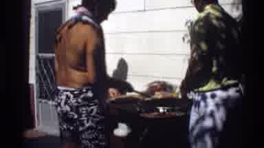California (1978): A Family Members Enjoys Their Food With Their Children Out In