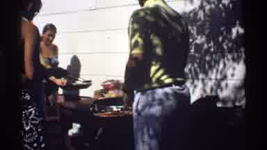 California (1978): Shirtless Men Outside In Swimwear Getting Food And Snacks From