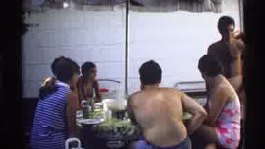 California (1978): A Family Members Enjoys Their Food With Their Children Out In