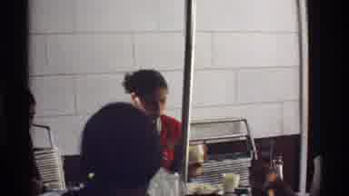 California (1978): Woman Wearing Red And White Shirt Spoons Food Onto Plate