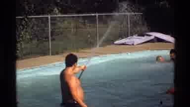 California (1978): Friends Having Fun In The Pool On A Sunny Day