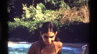California (1978): Girl With Bikini Walks Towards The Camera Then Throws A Ball To