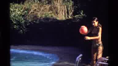 California (1978): Girl In A Bikini By The Pool Does A Trick With A Ball By The