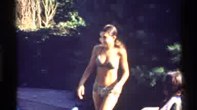 California (1978): Girl In Bikini Watches Man In Swimming Pool Dive Under Water