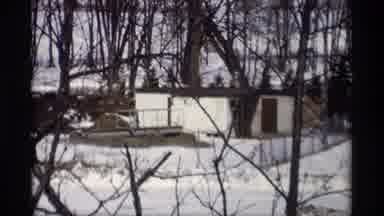 Madison Wisconsin (1966): View Of White Shed And Melting Snow On A Clear Day