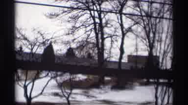 Madison Wisconsin (1966): A Building Stands In A Field Covered With Snow And Trees