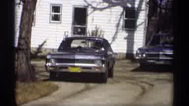 Madison Wisconsin (1966): Old Video Of Starting A Blue Car In A Garden In Front Of