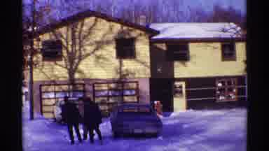 Chicago Illinois (1968): View Of Snow Covered House And People Walking In Snow On