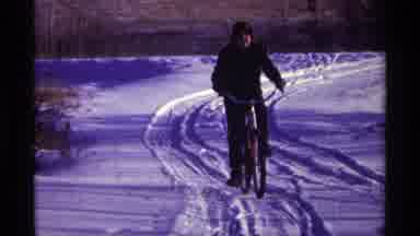 Chicago Illinois (1968): A Man Driving A Bicycle In The Snow Land The Part Of
