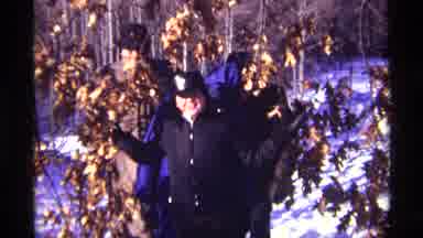 Chicago Illinois (1968): Four People Walking Through The Snow Wearing Jackets And