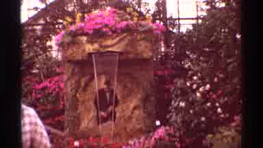 Chicago Illinois (1968): Man Standing Under A Fountain In A Suit Lion