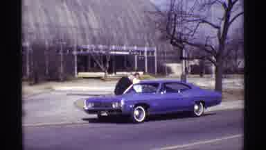 Chicago Illinois (1968): A Man Opens The Car Door For The Women On The Street