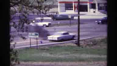 Chicago Illinois (1968): A Car Is Smoking And Is About To Blow Up The People