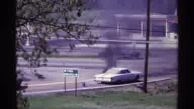 Chicago Illinois (1968): A Car Getting On Fire Close To A Big Road While A Big