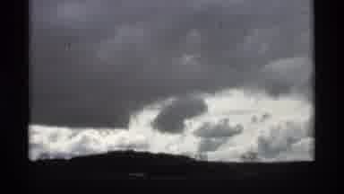 Holland Michigan (1969): Cloud Formations In Sky Overcast Gray Filmed From Moving
